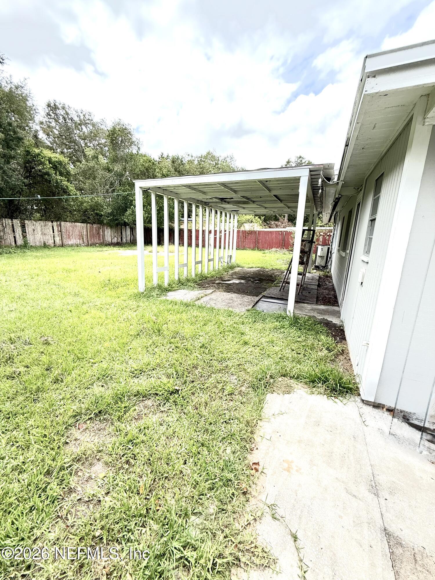 10162 Herndon Road Jacksonville, FL 32246 - Photo 27 of 31 a view of a yard with swimming pool