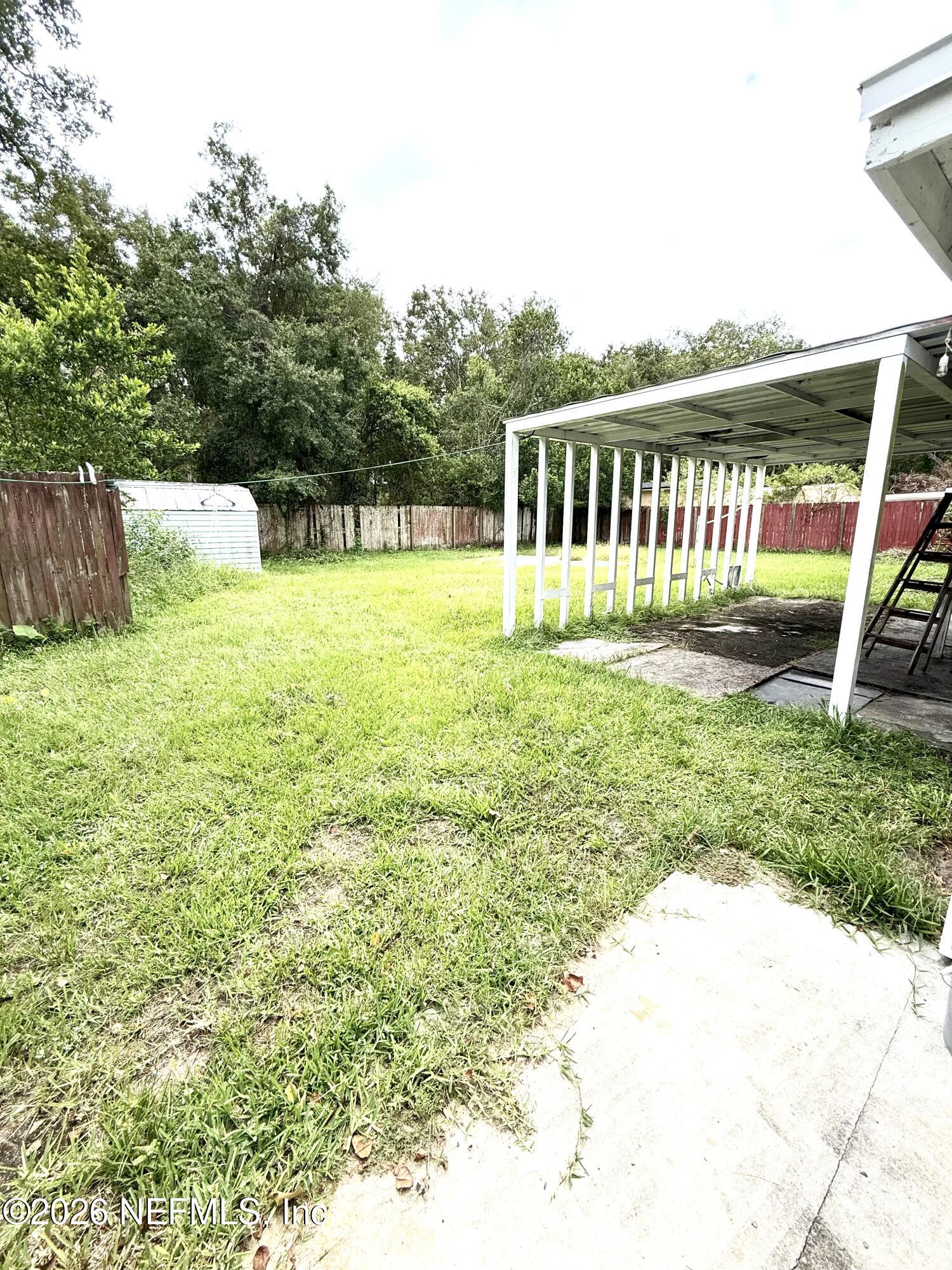 10162 Herndon Road Jacksonville, FL 32246 - Photo 28 of 31 a view of a garden with a house