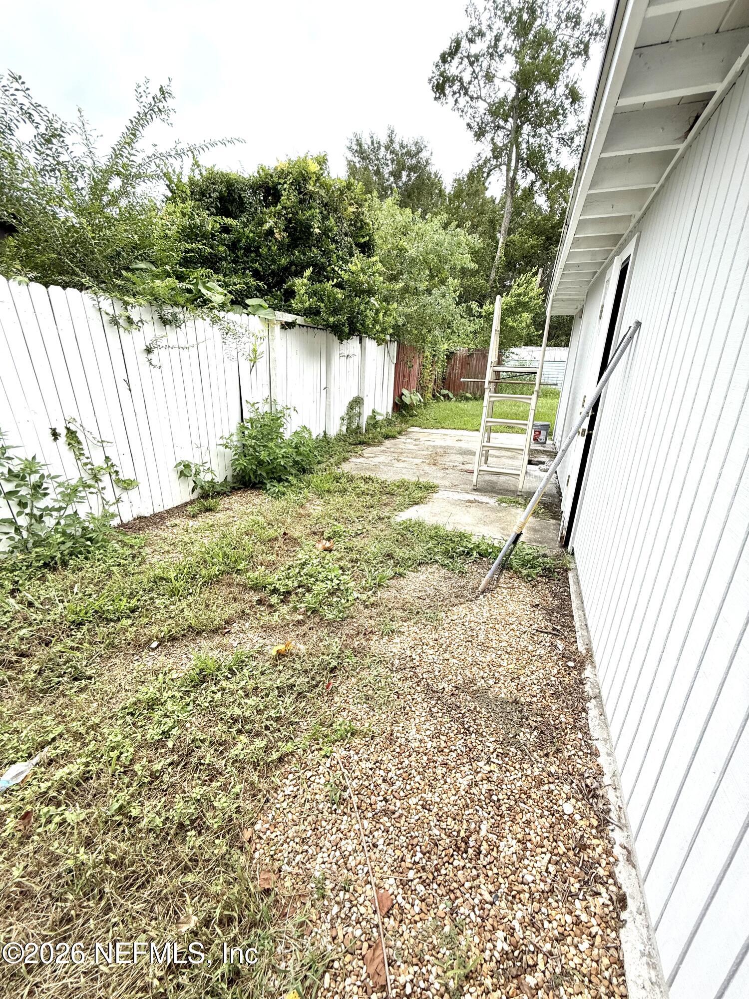 10162 Herndon Road Jacksonville, FL 32246 - Photo 29 of 31 a view of a backyard with small cabin
