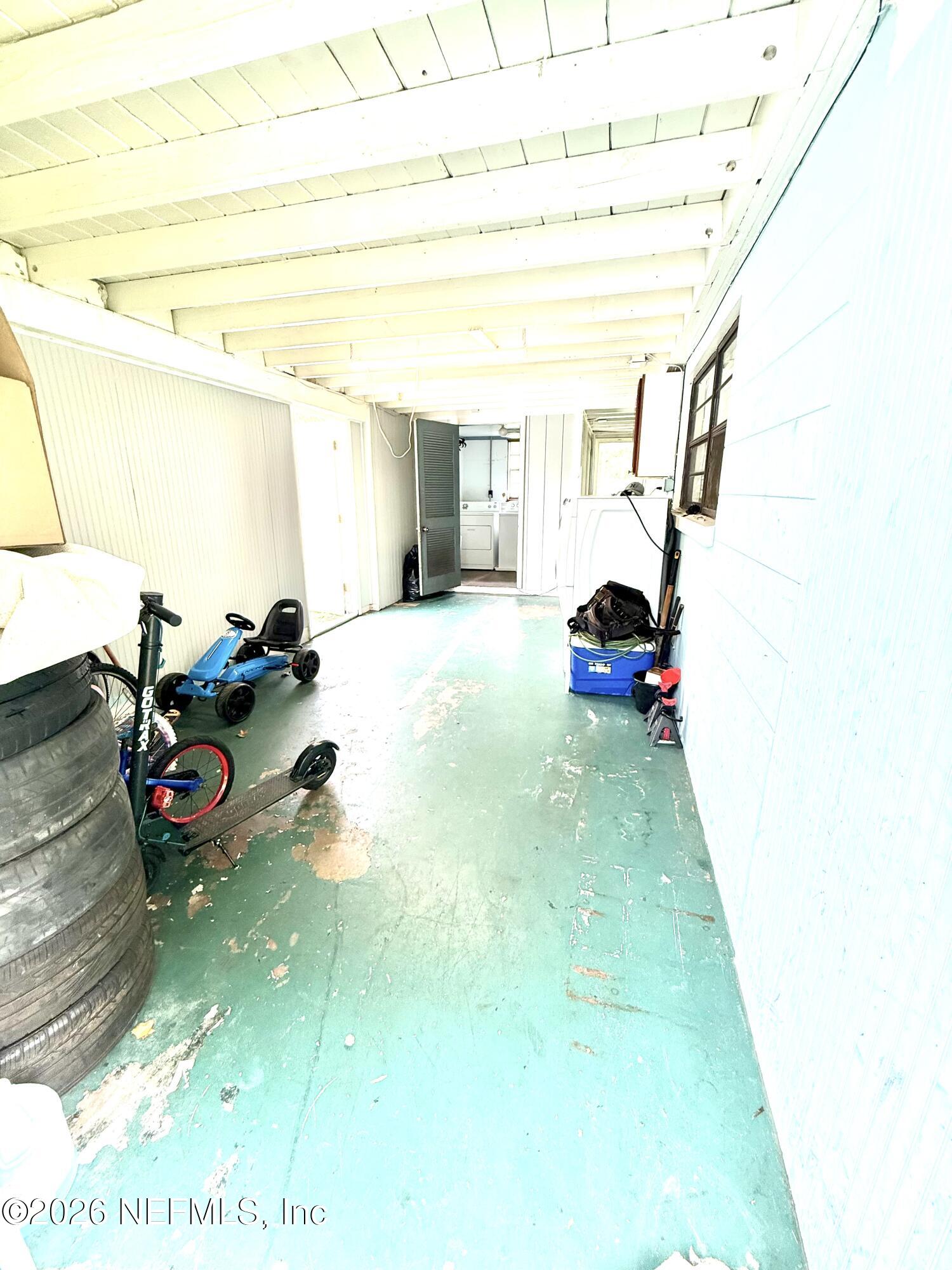 10162 Herndon Road Jacksonville, FL 32246 - Photo 30 of 31 a bedroom with a bed and a window