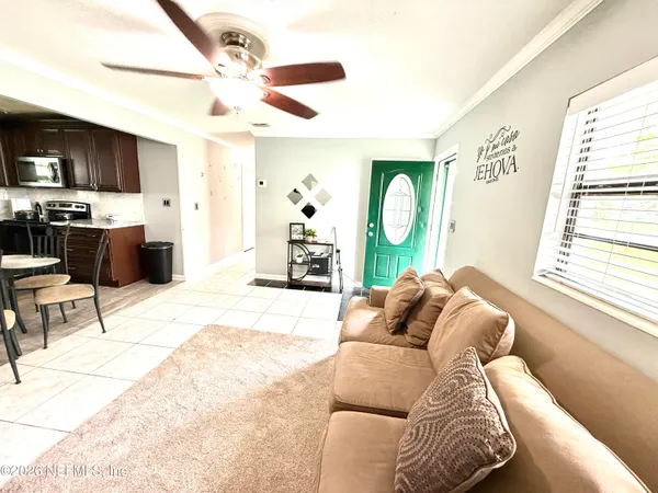 a living room with a couch and a large window