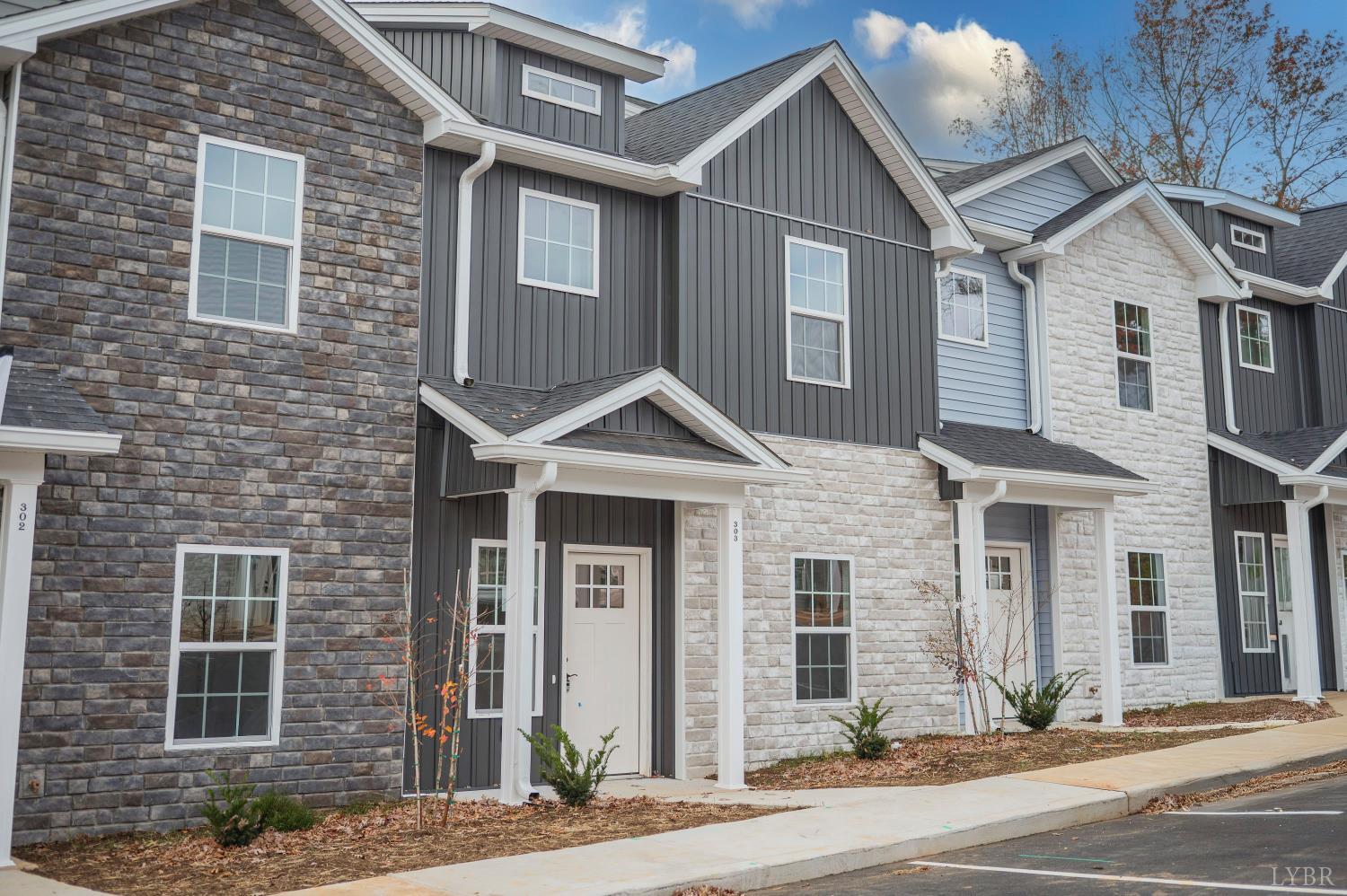 536 Leesville Road, Unit 303 Lynchburg, VA 24502 - Photo 34 of 34 a front view of a house with a yard