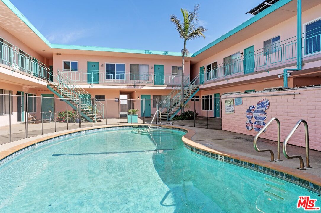 7825 West Manchester Avenue, Unit 6 Playa del Rey, CA 90293 - Photo 1 of 11 a view of a building with a backyard porch and sitting area