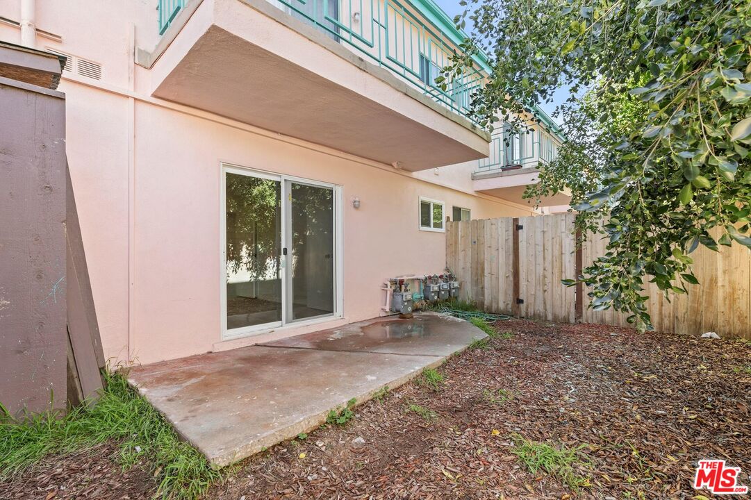 7825 West Manchester Avenue, Unit 6 Playa del Rey, CA 90293 - Photo 9 of 11 a front view of a house with a yard