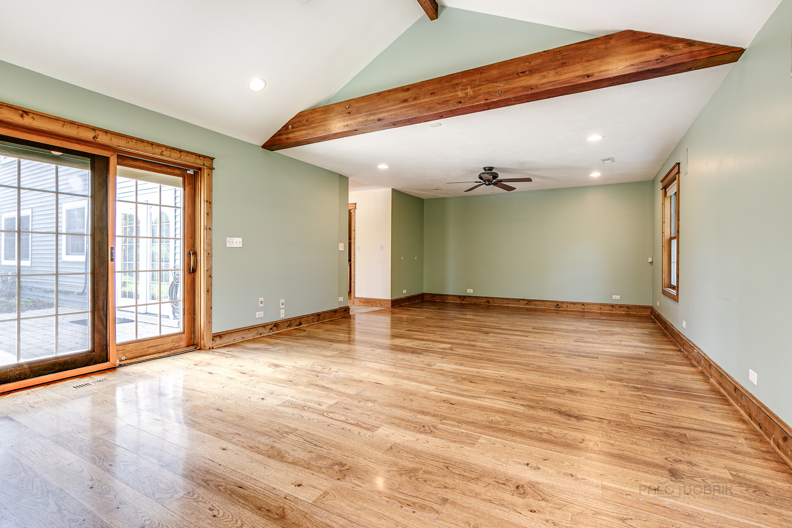 591 Surryse Road Lake Zurich, IL 60047 - Photo 15 of 33 an empty room with wooden floor and windows