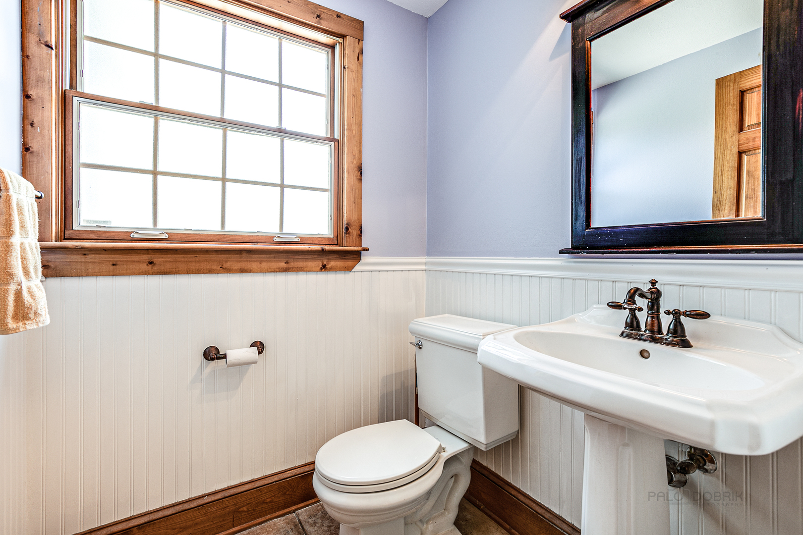 591 Surryse Road Lake Zurich, IL 60047 - Photo 17 of 33 a bathroom with a sink a toilet and a mirror