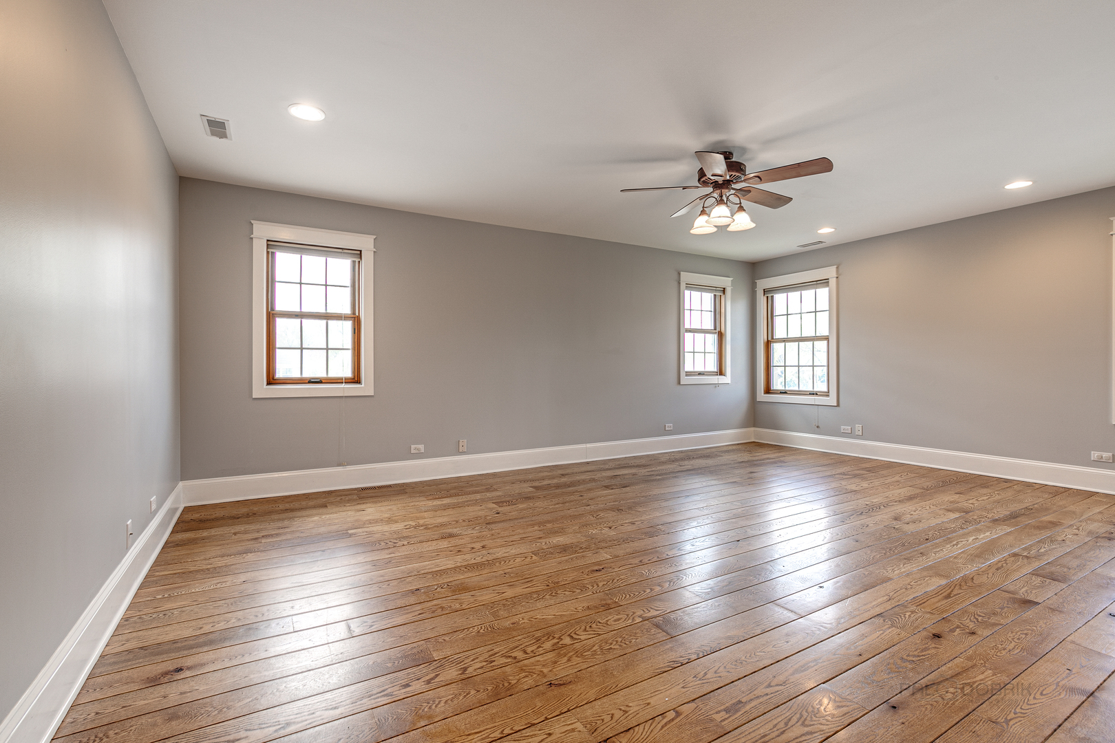 591 Surryse Road Lake Zurich, IL 60047 - Photo 18 of 33 a view of an empty room with wooden floor and a window