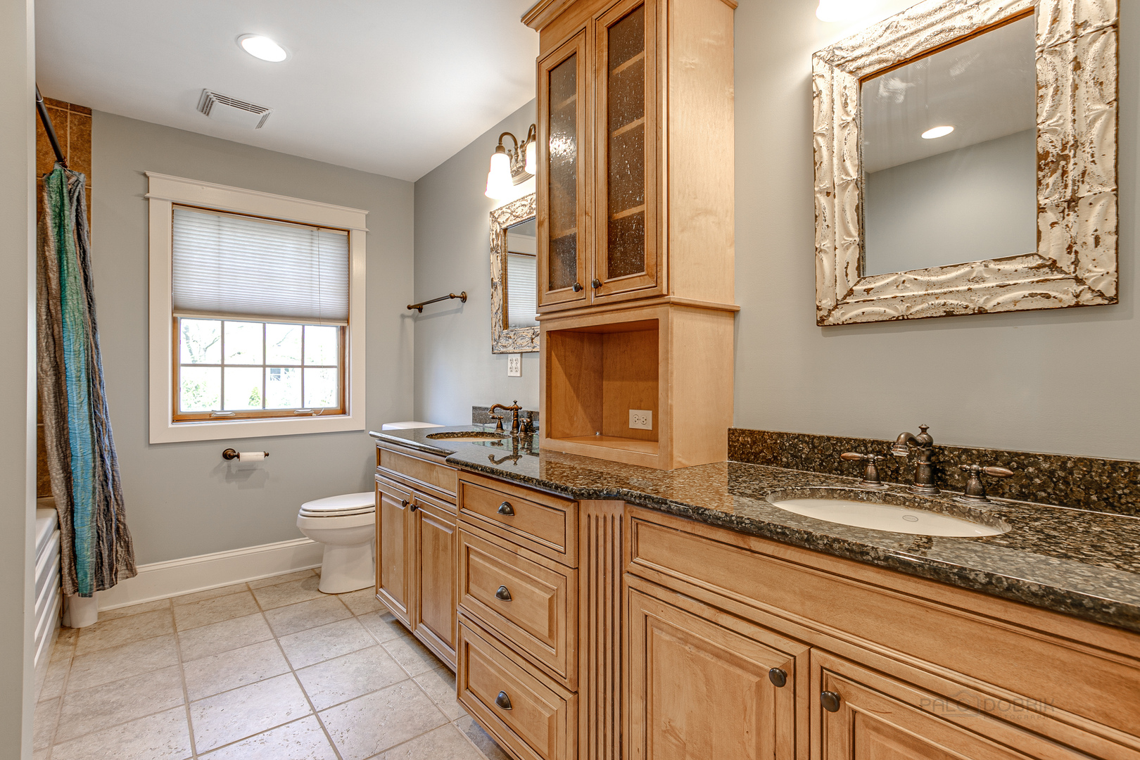 591 Surryse Road Lake Zurich, IL 60047 - Photo 20 of 33 a spacious bathroom with a granite countertop sink a toilet and a mirror
