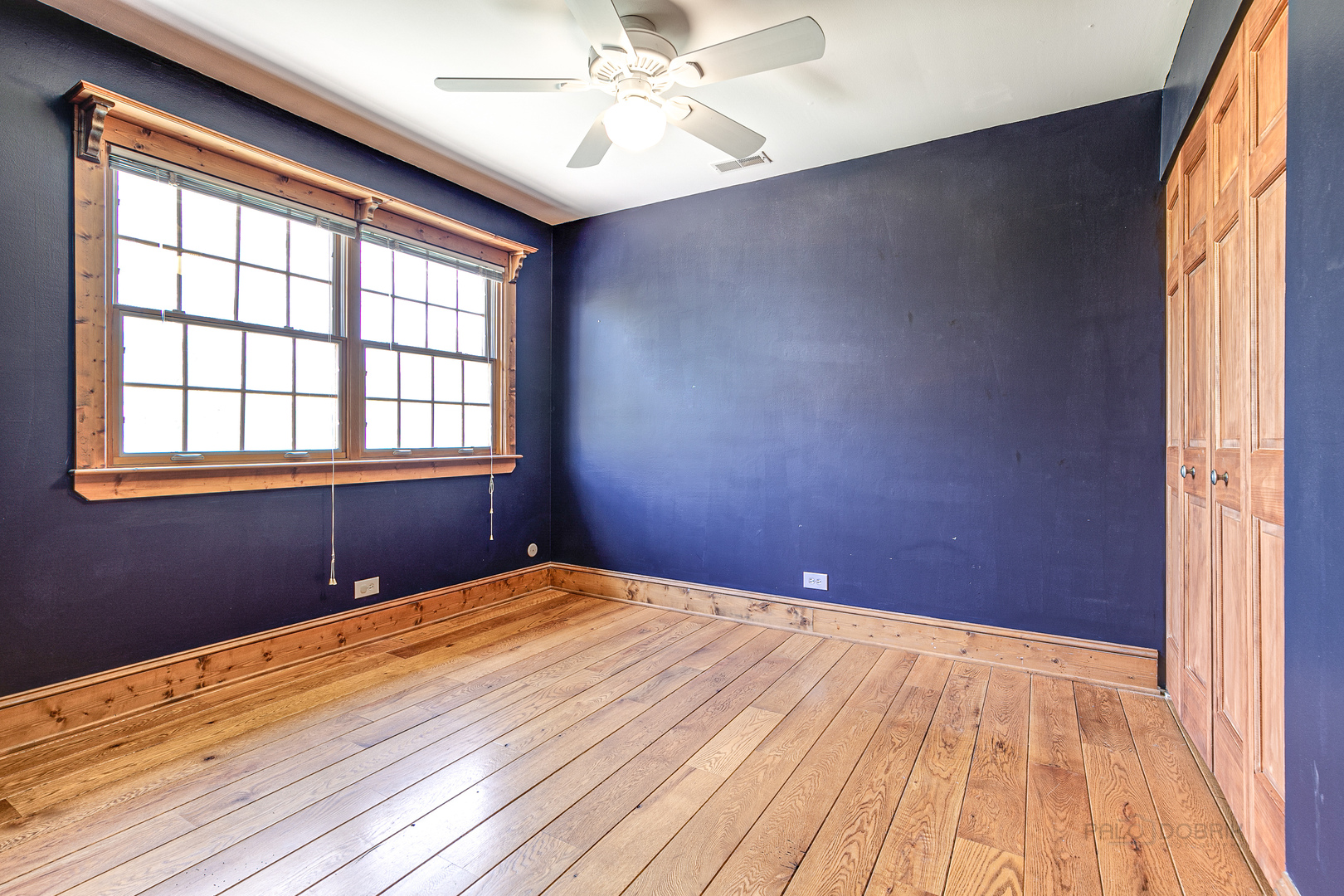 591 Surryse Road Lake Zurich, IL 60047 - Photo 22 of 33 a view of an empty room with a window and wooden floor