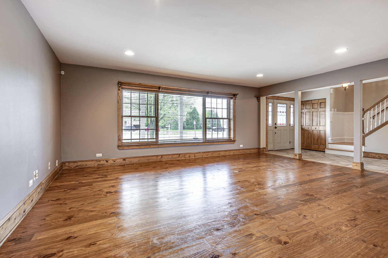 591 Surryse Road Lake Zurich, IL 60047 - Photo 7 of 33 a view of empty room with wooden floor and fan