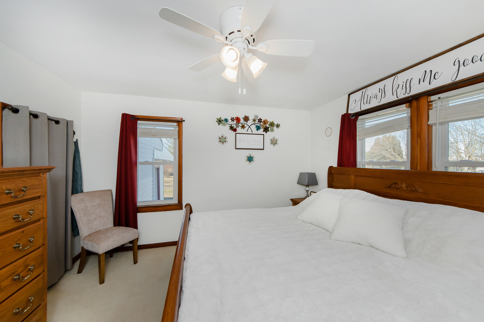301 West Broad Street Rutland, IL 61358 - Photo 16 of 39 a bedroom with a large bed and a chandelier