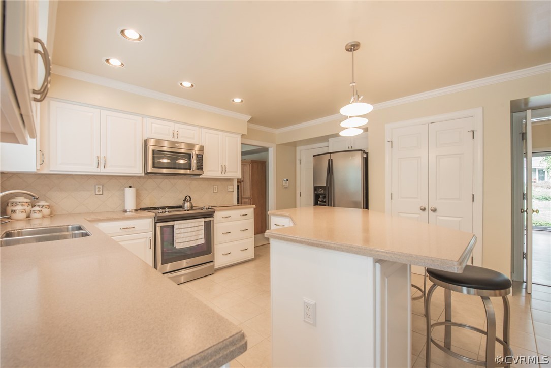 5316 Meadow Chase Road Midlothian, VA 23112 - Photo 15 of 31 a kitchen with granite countertop a stove a sink and a refrigerator