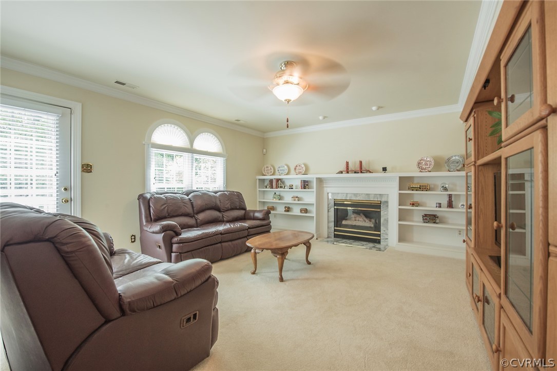5316 Meadow Chase Road Midlothian, VA 23112 - Photo 17 of 31 a living room with furniture a fireplace and a large window