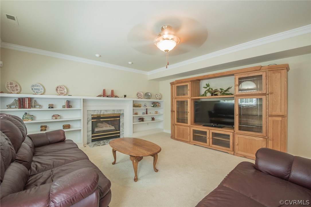 5316 Meadow Chase Road Midlothian, VA 23112 - Photo 19 of 31 a living room with furniture a fireplace and a flat screen tv