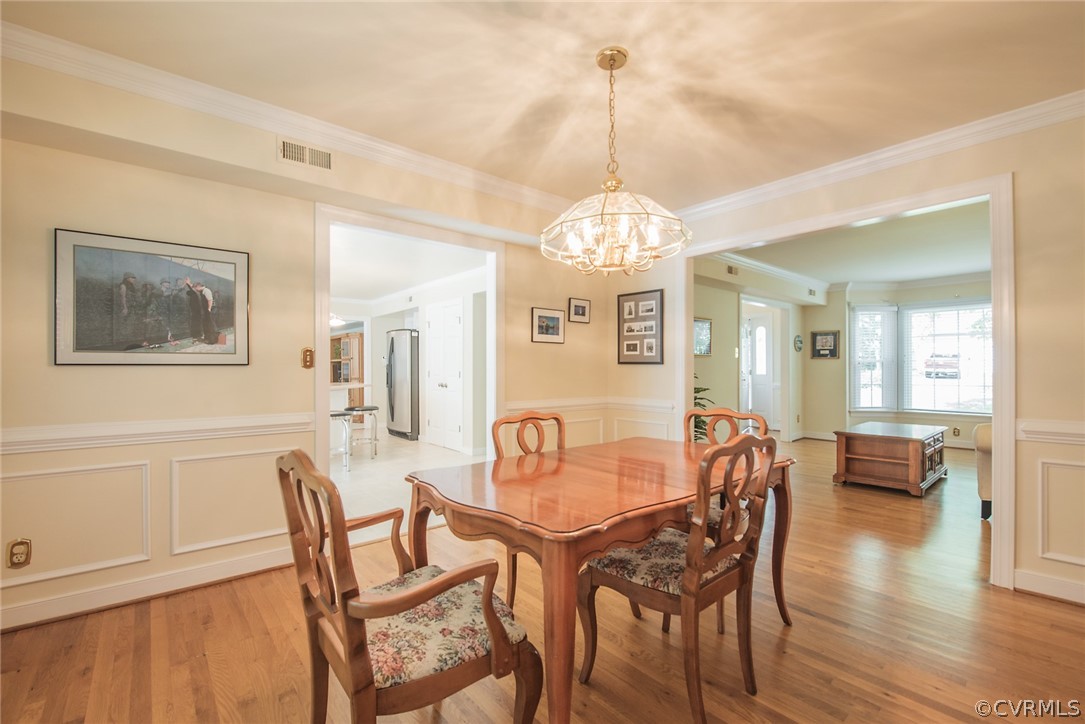 5316 Meadow Chase Road Midlothian, VA 23112 - Photo 8 of 31 a view of a dining room with furniture wooden floor and chandelier