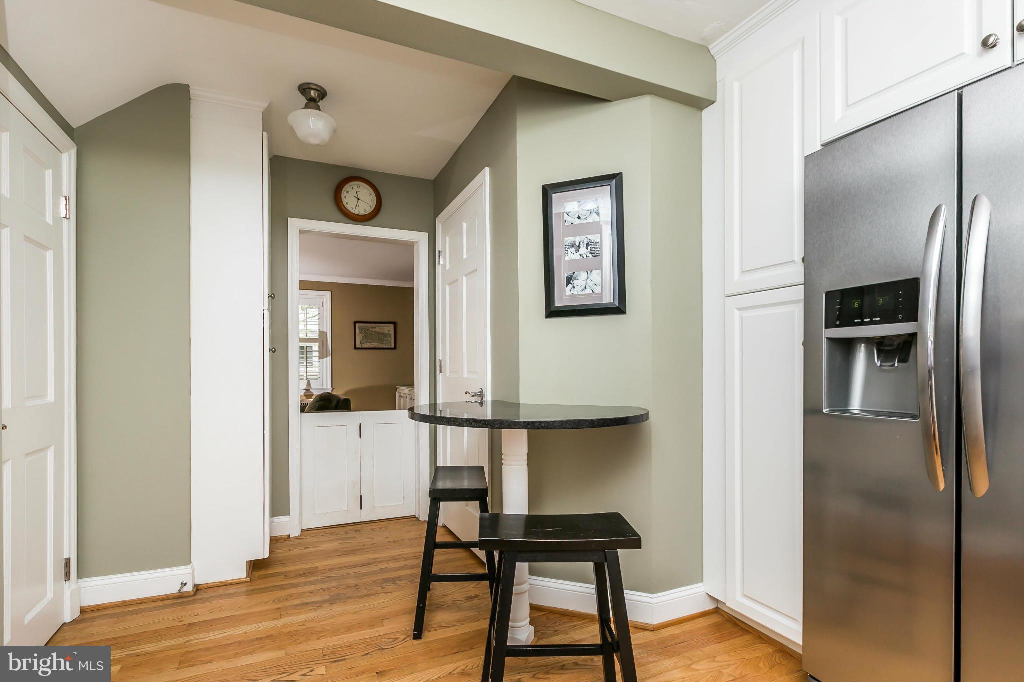 5716 Kenmore Road Baltimore, MD 21210 - Photo 11 of 30 a view of kitchen with furniture refrigerator and wooden floor