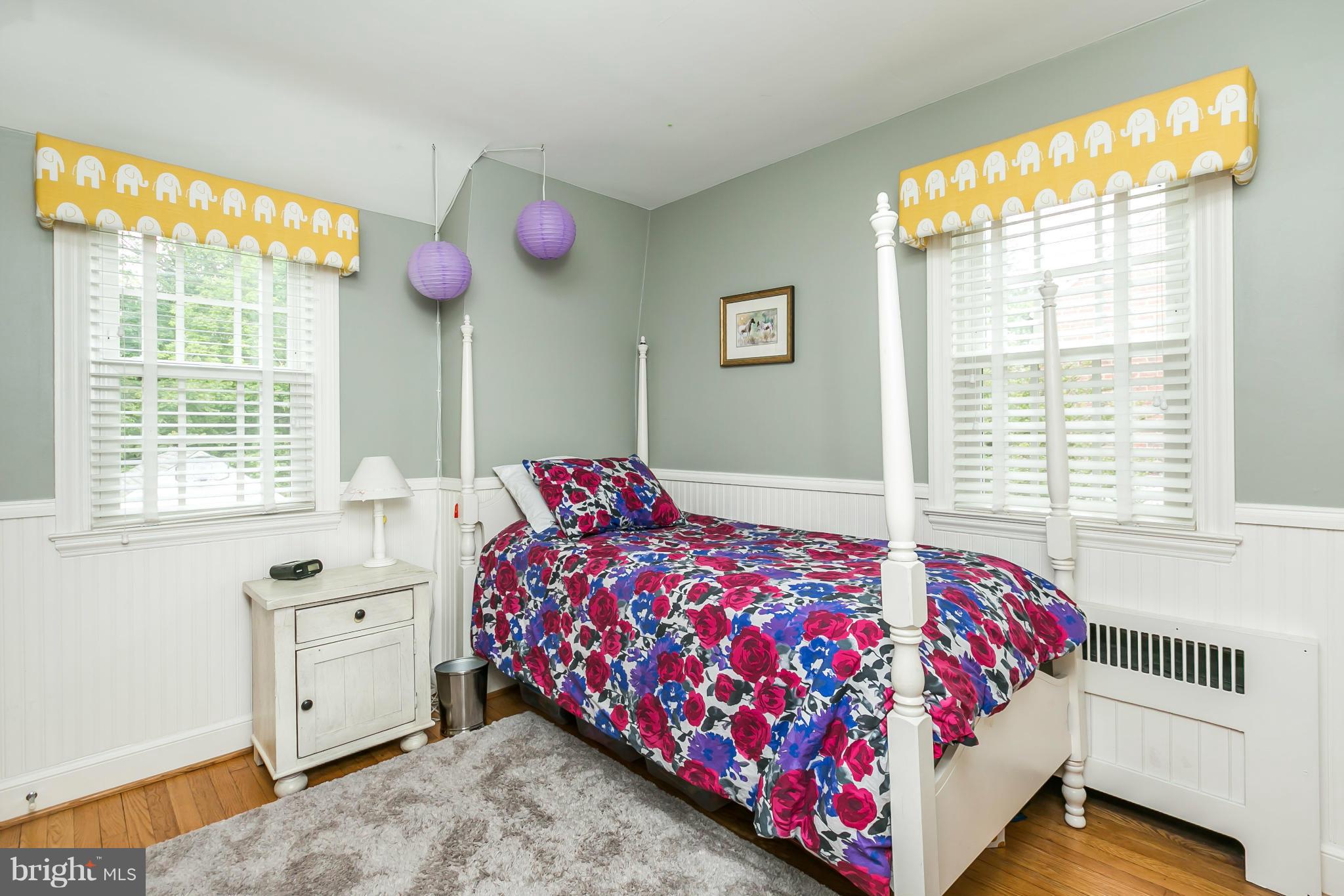 5716 Kenmore Road Baltimore, MD 21210 - Photo 16 of 30 a bedroom with a bed and a window