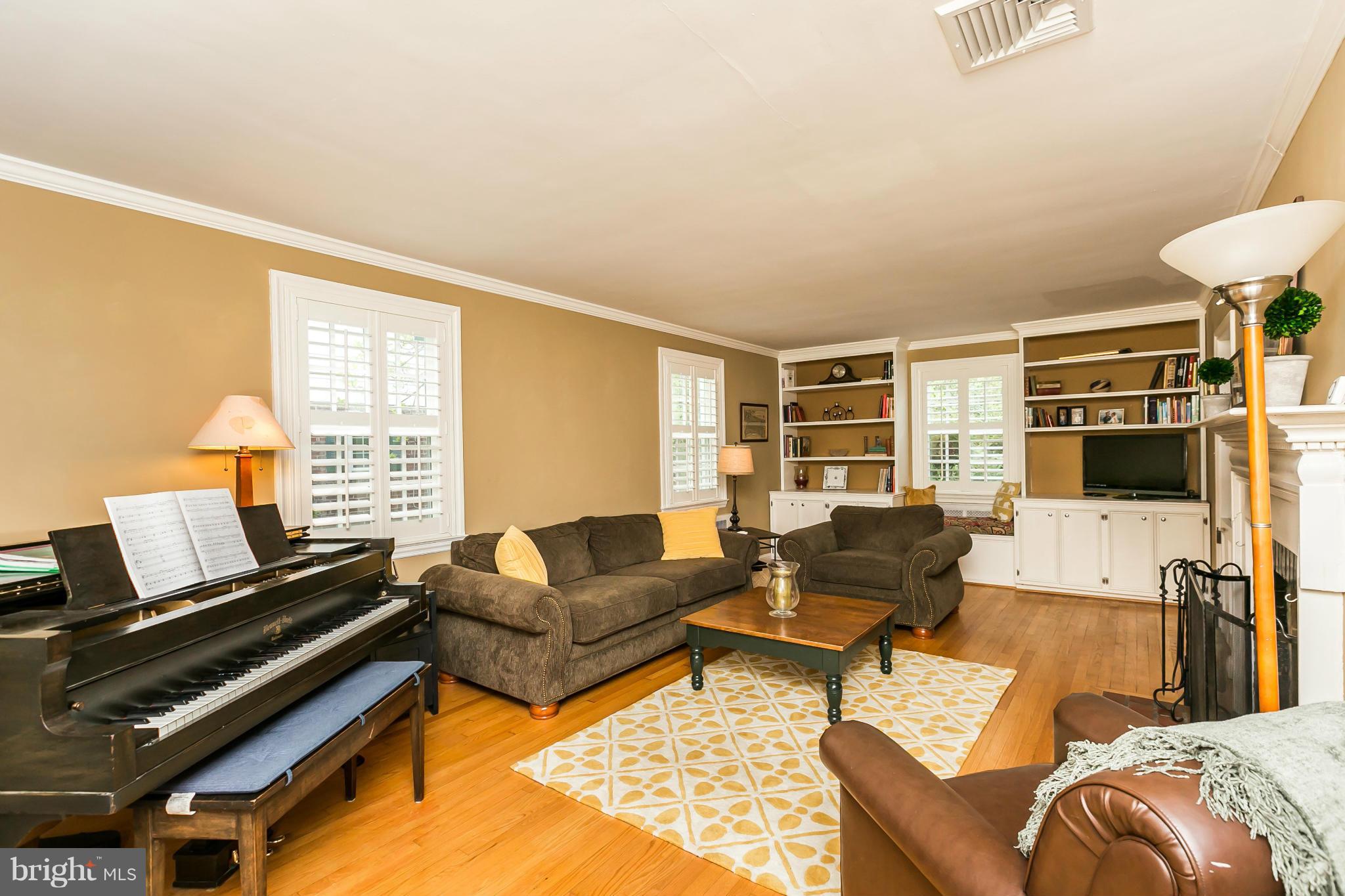 5716 Kenmore Road Baltimore, MD 21210 - Photo 3 of 30 a living room with furniture and a flat screen tv