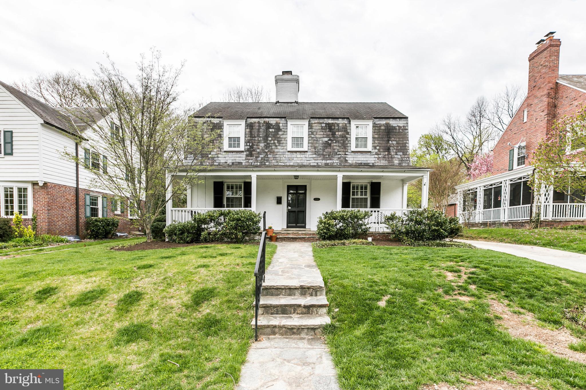 5716 Kenmore Road Baltimore, MD 21210 - Photo 21 of 30 a front view of a brick house with a yard