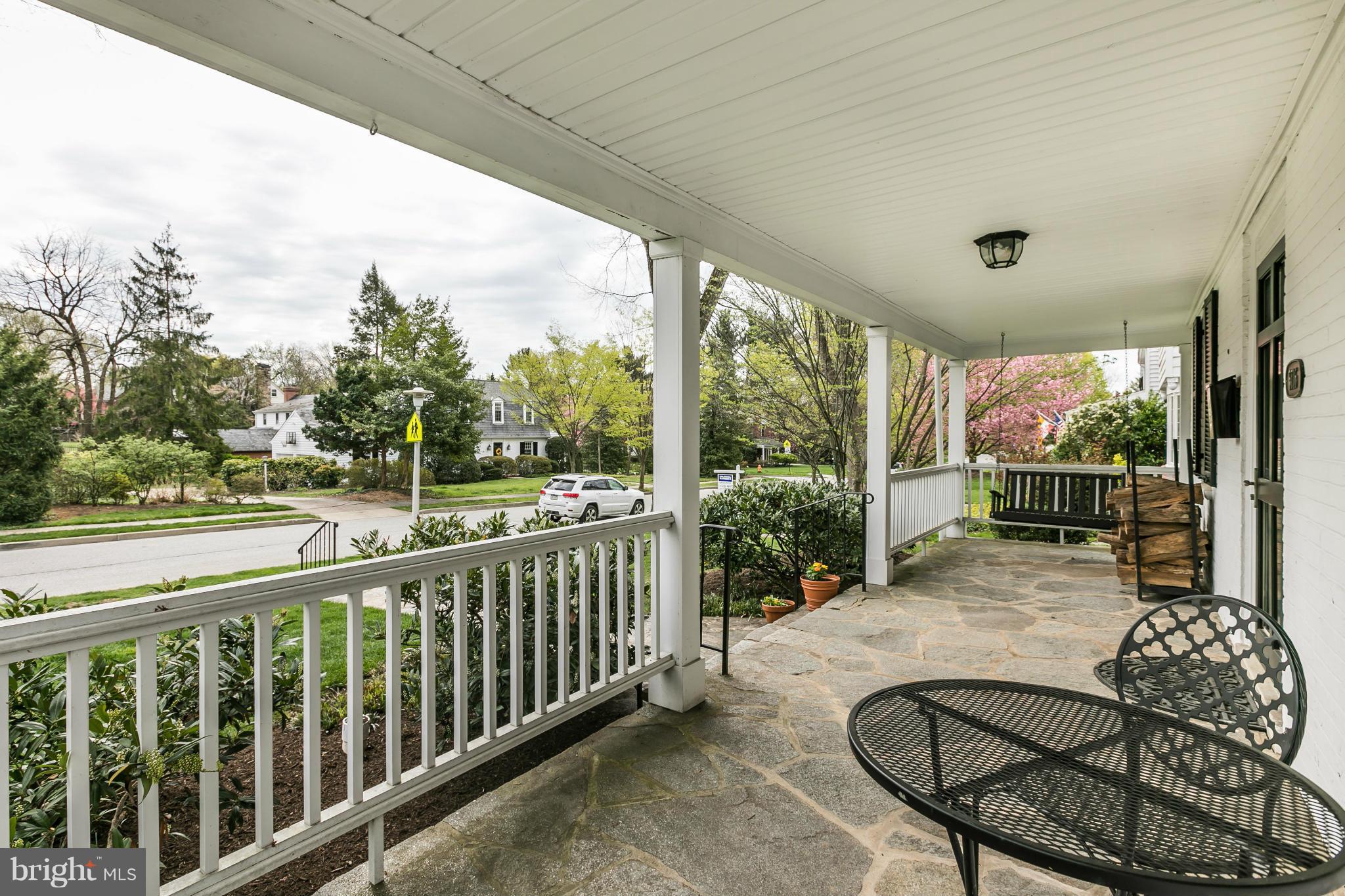 5716 Kenmore Road Baltimore, MD 21210 - Photo 24 of 30 a balcony with furniture and a swing
