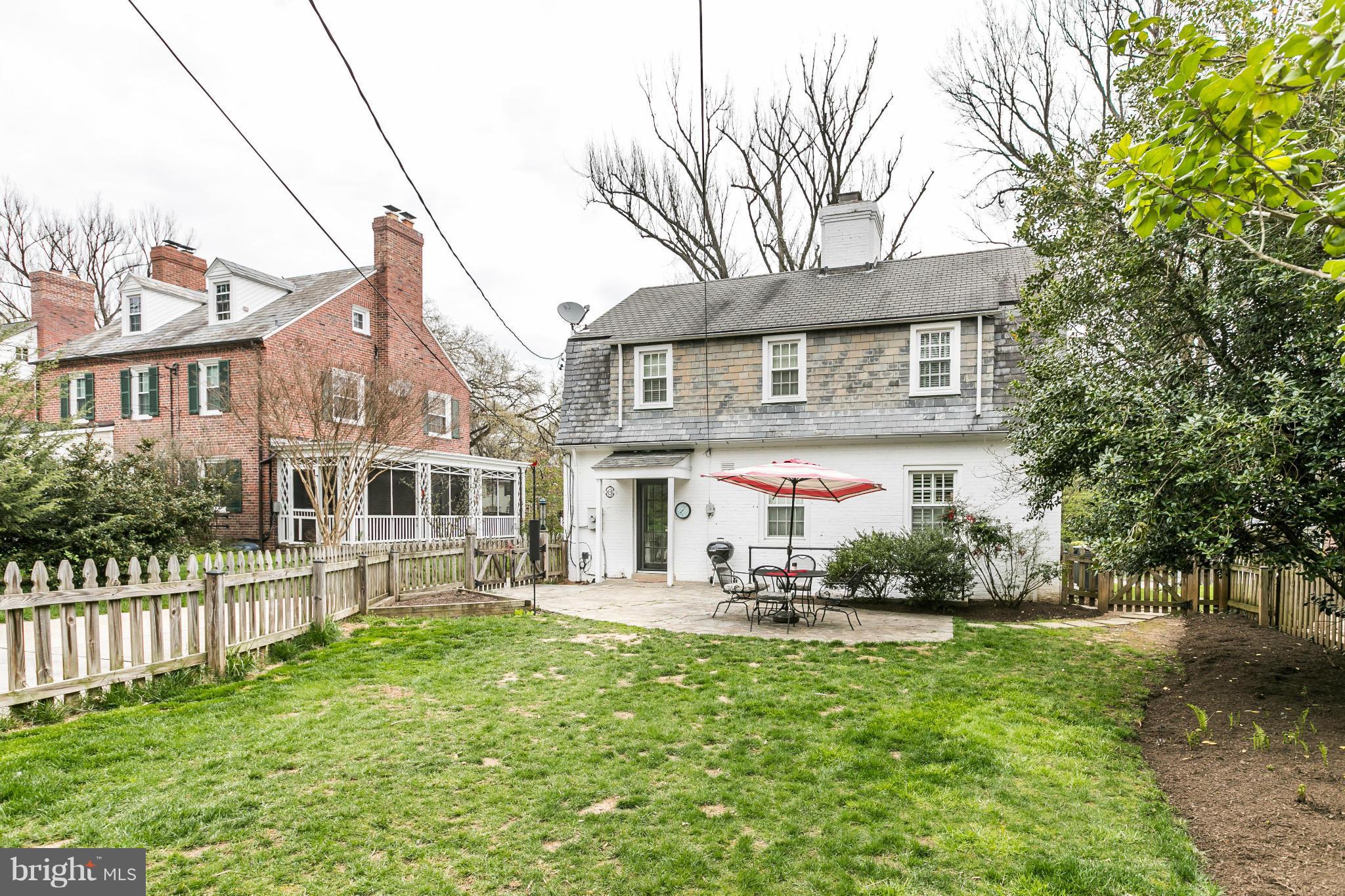 5716 Kenmore Road Baltimore, MD 21210 - Photo 26 of 30 a front view of a house with a yard table and chairs