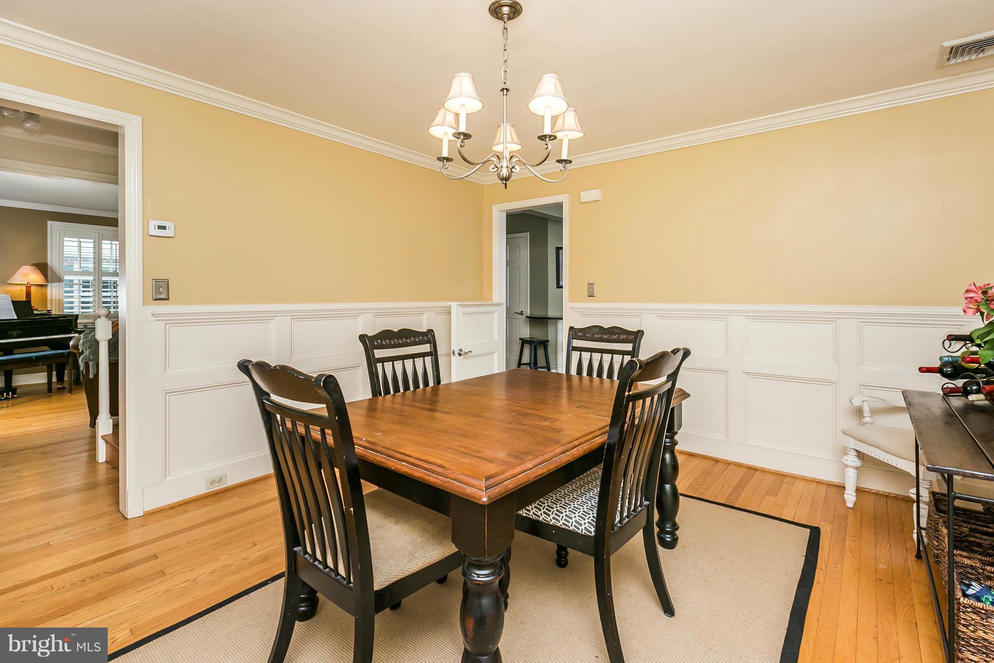 5716 Kenmore Road Baltimore, MD 21210 - Photo 6 of 30 a view of a dining room with furniture and wooden floor