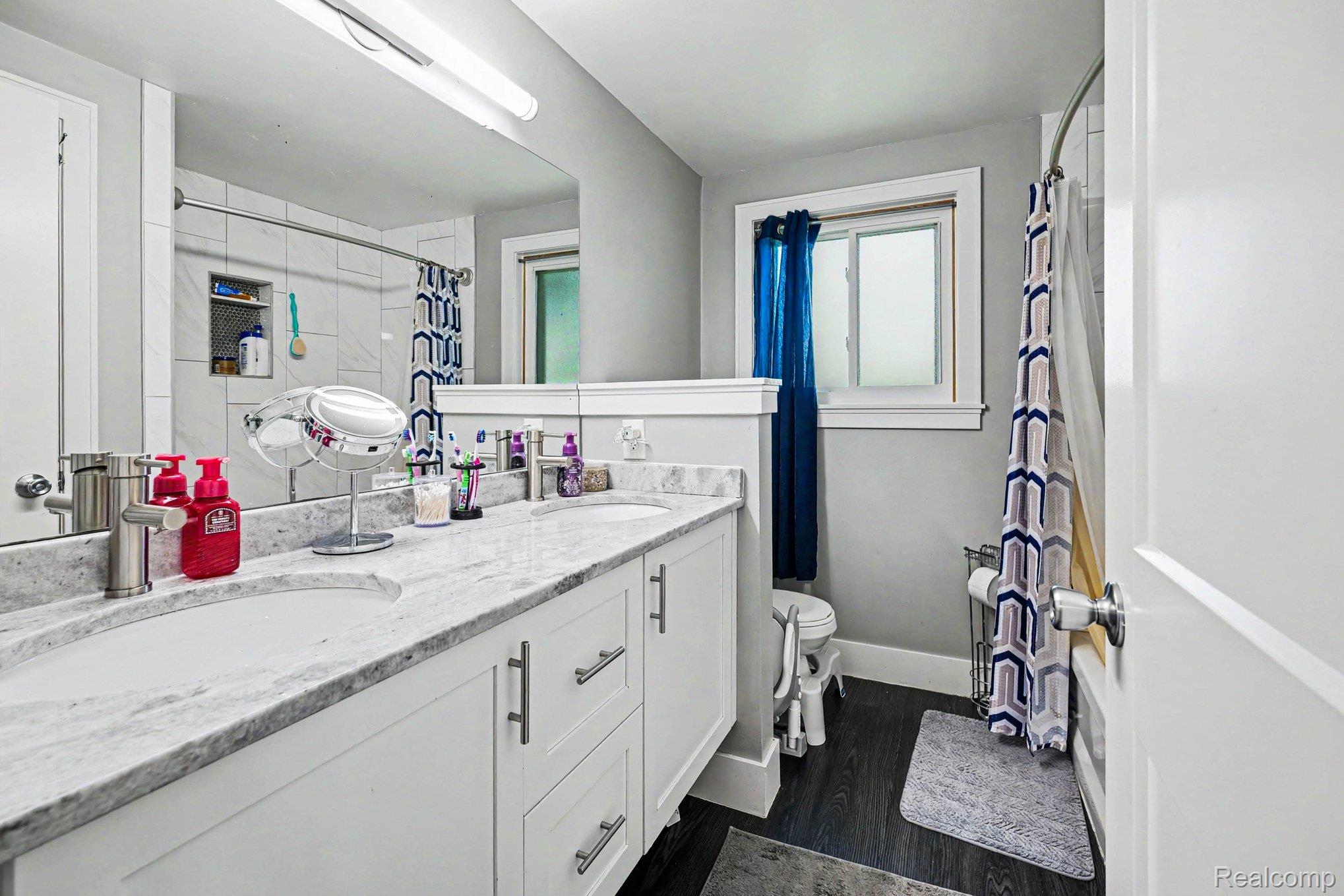 30831 Ridgefield Avenue Warren, MI 48088 - Photo 13 of 17 Double vanity with integrated sinks and a stone countertop