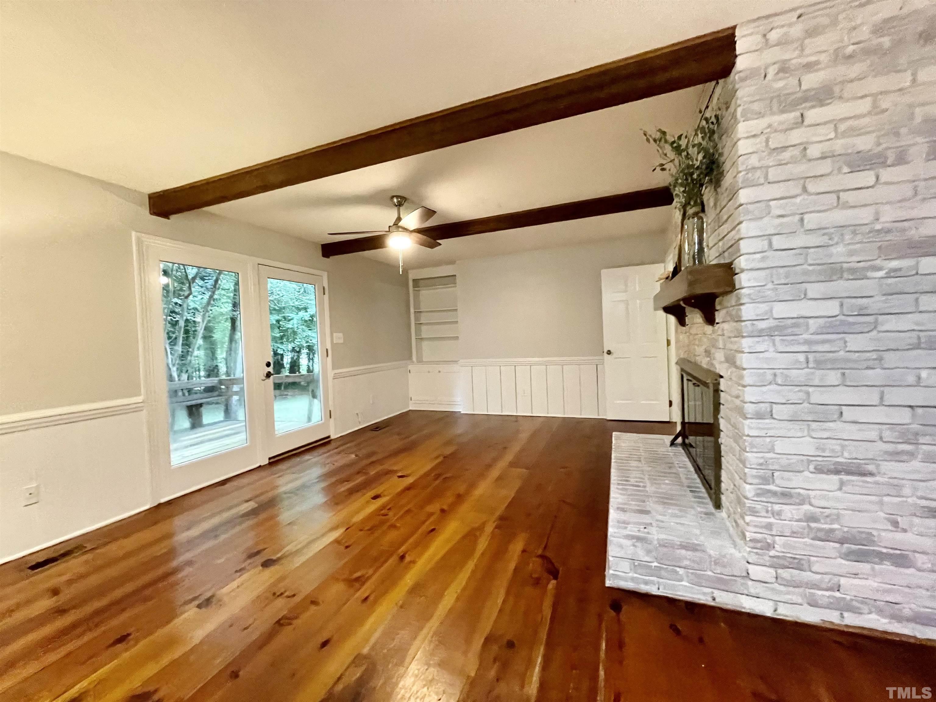 3100 Shadwell Court Raleigh, NC 27613 - Photo 15 of 30 a view of empty room with wooden floor and fan
