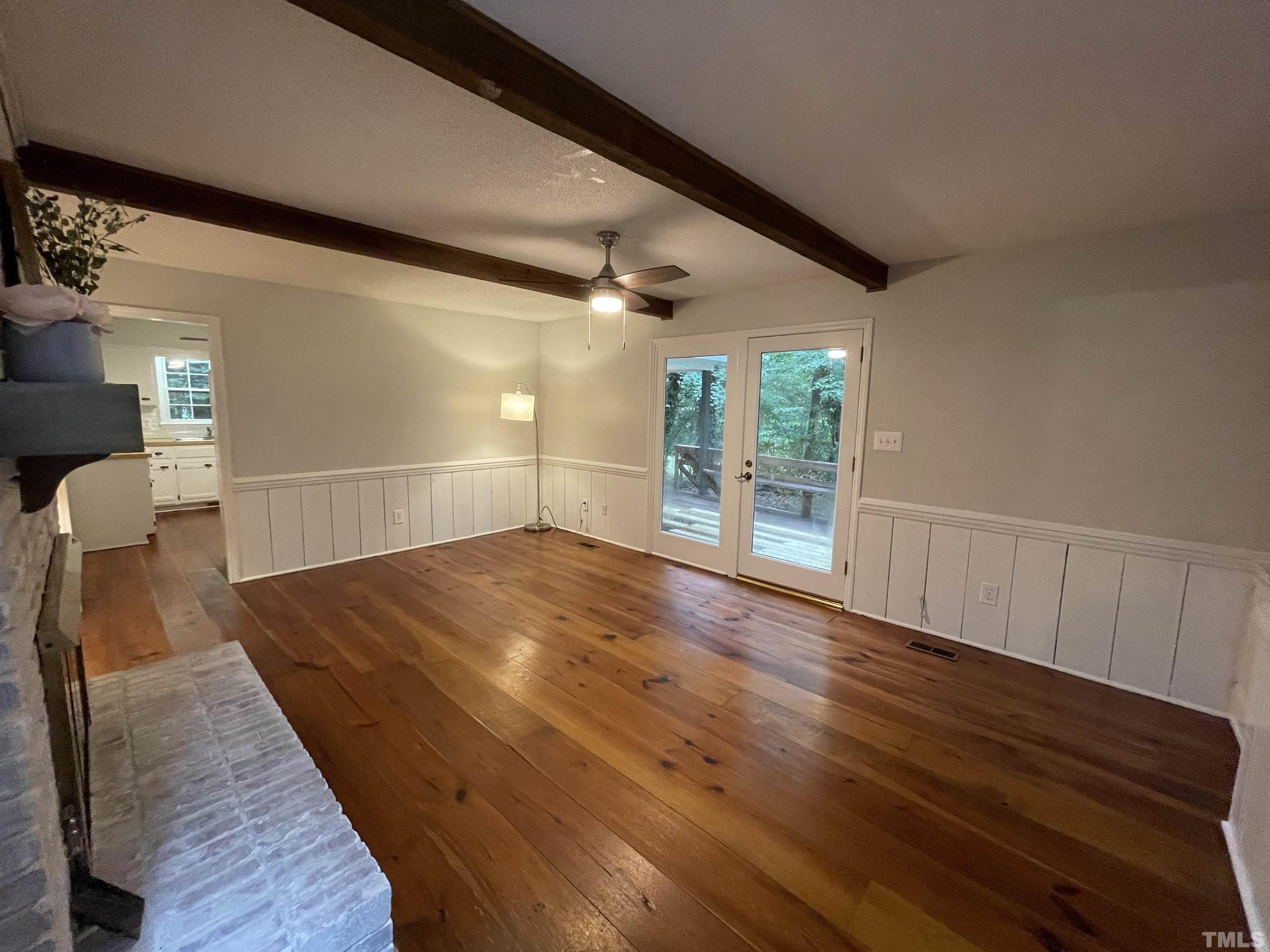 3100 Shadwell Court Raleigh, NC 27613 - Photo 18 of 30 wooden floor in an empty room with a window
