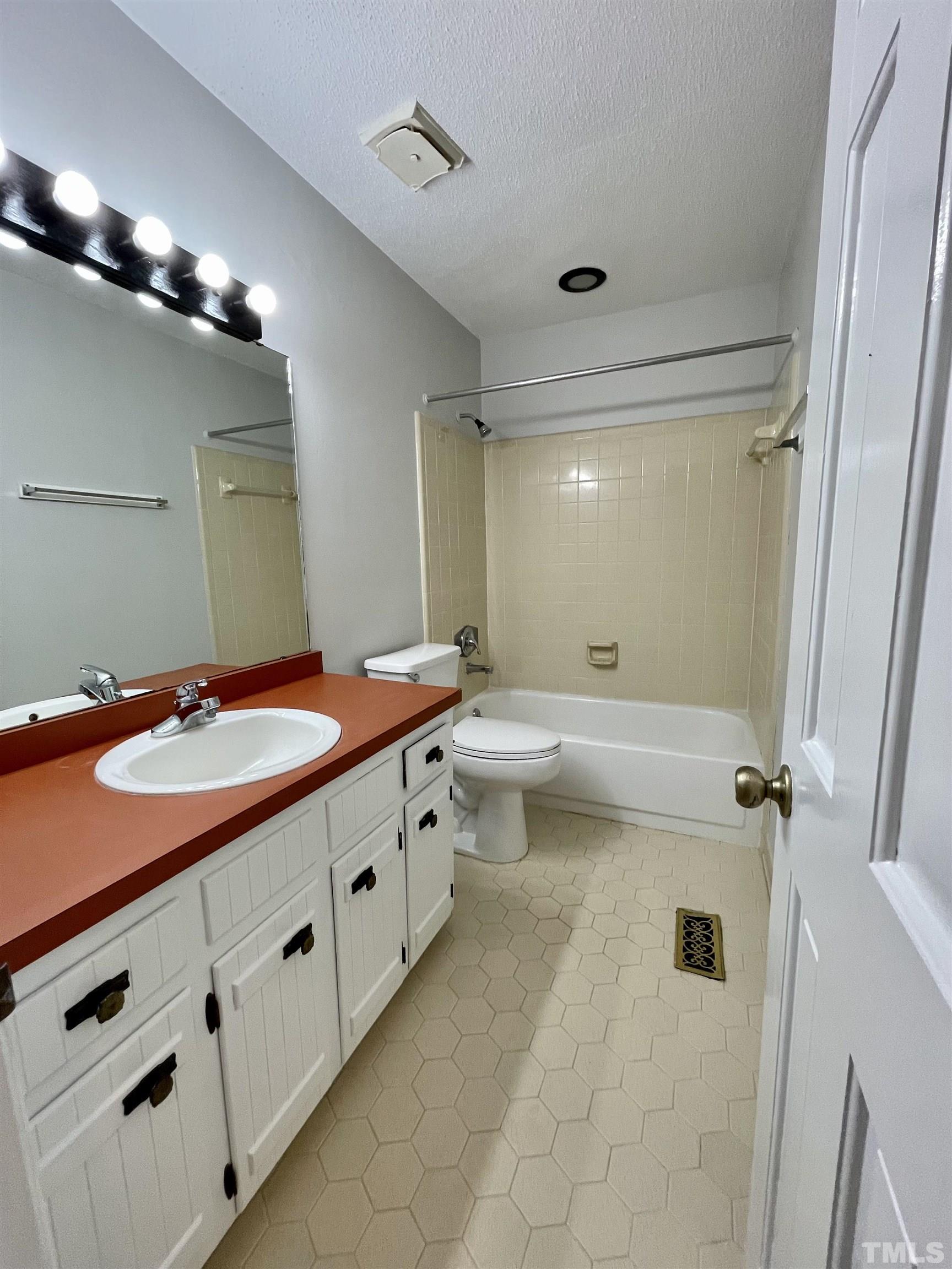 3100 Shadwell Court Raleigh, NC 27613 - Photo 19 of 30 a bathroom with double sink and a mirror