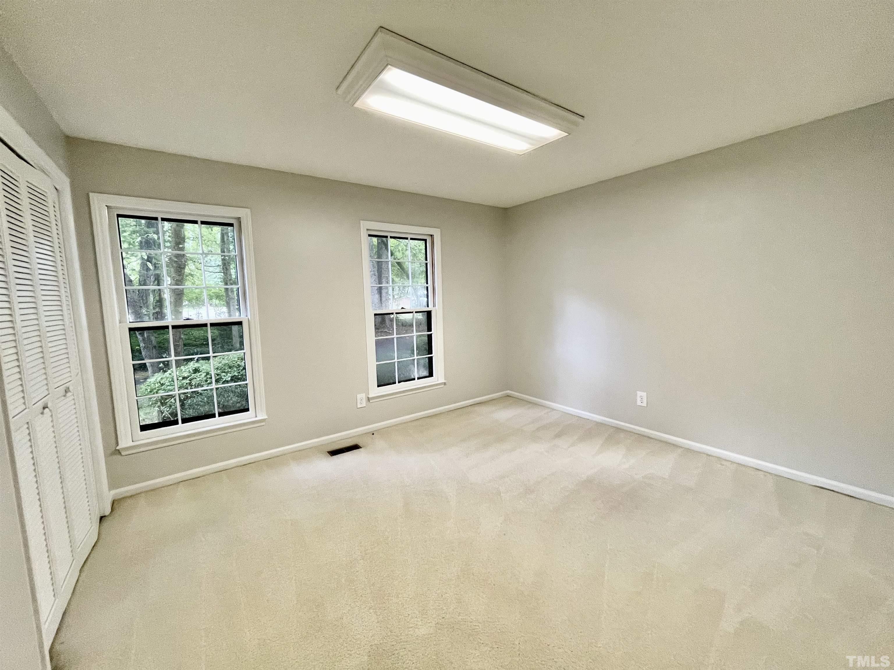 3100 Shadwell Court Raleigh, NC 27613 - Photo 26 of 30 an empty room with windows