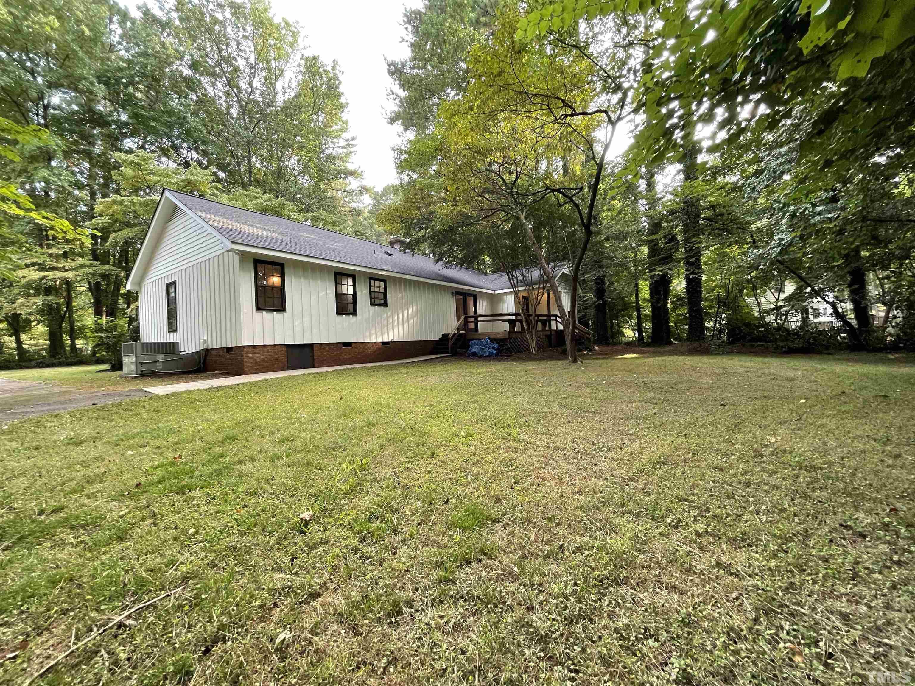 3100 Shadwell Court Raleigh, NC 27613 - Photo 29 of 30 a view of a house with a yard