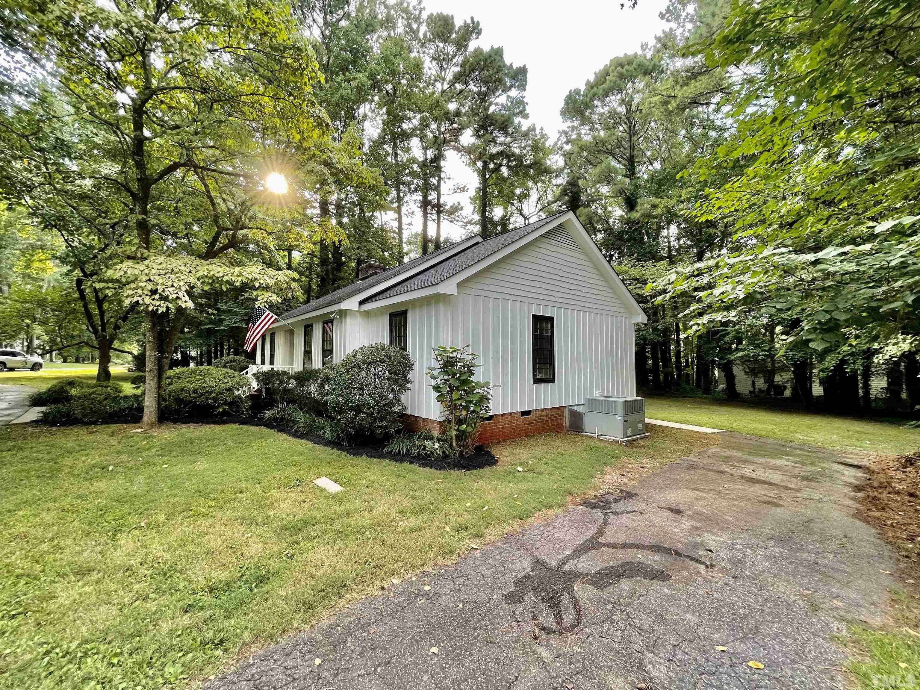 3100 Shadwell Court Raleigh, NC 27613 - Photo 4 of 30 a view of a house with backyard and trees