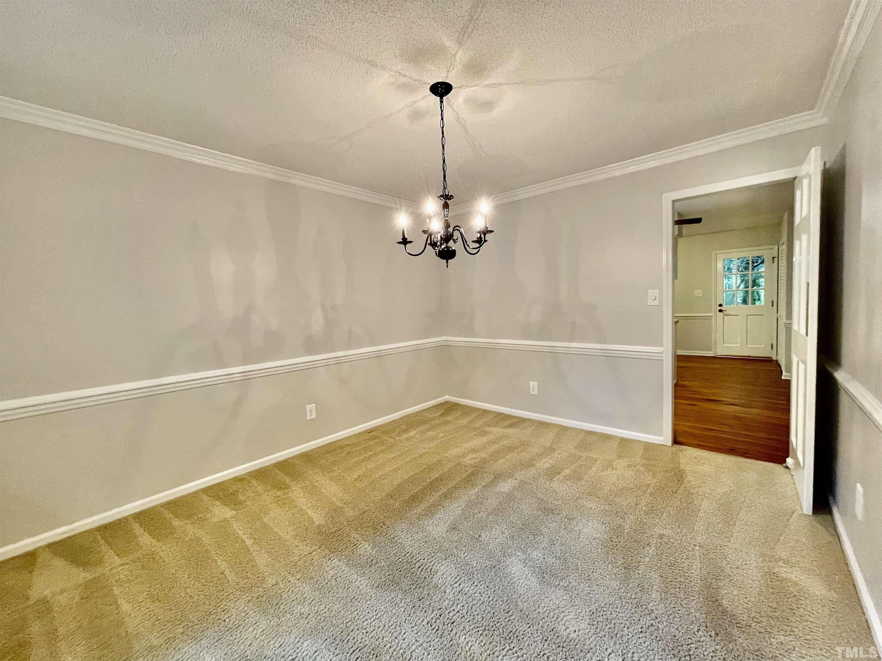3100 Shadwell Court Raleigh, NC 27613 - Photo 9 of 30 a view of a room with a chandelier fan and windows