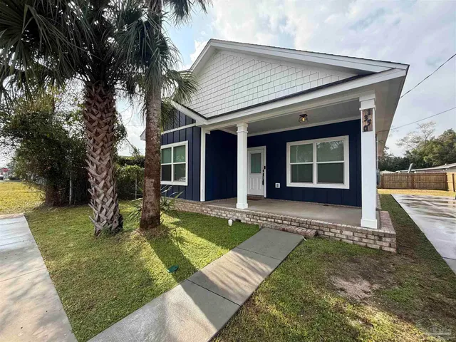front view of a house with a yard
