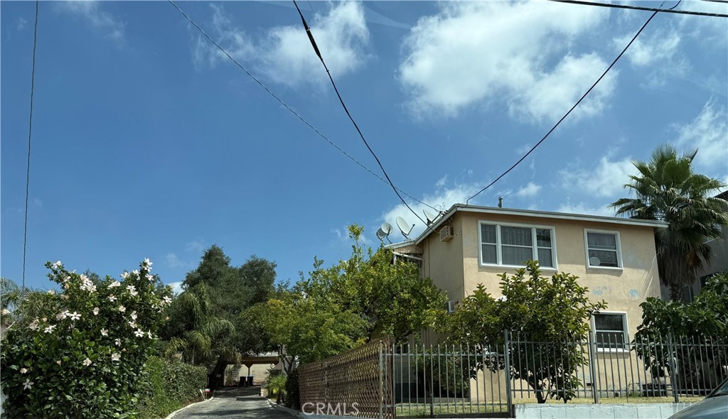 7061 Greeley Street Tujunga, CA 91042 - Photo 1 of 14 a view of a house with a backyard