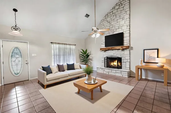 a table with chairs and a potted plant