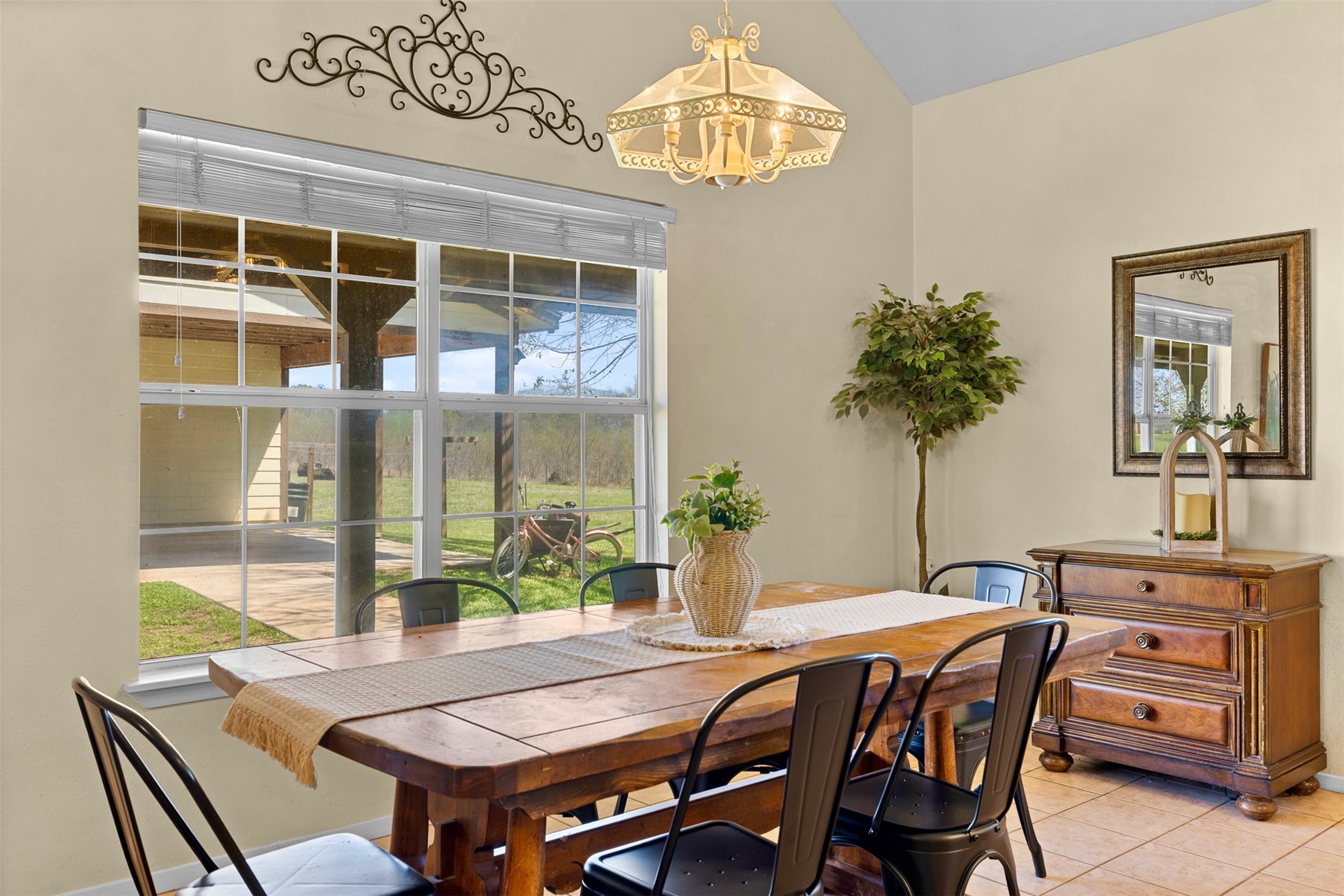 999 Salem Road Brenham, TX 77833 - Photo 23 of 40 a dining room with furniture a chandelier and window