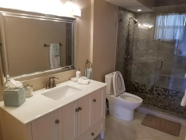 a bathroom with a sink and shower