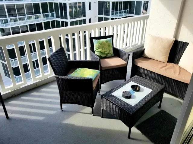 a view of balcony with furniture