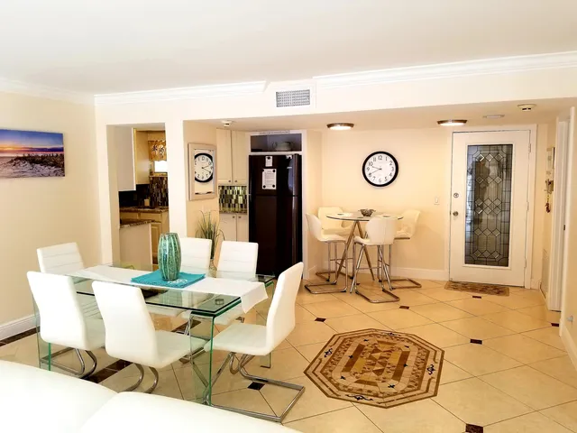 a kitchen with a sink a stove and a microwave