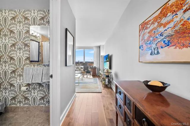 a view of a dining room with furniture and a chandelier