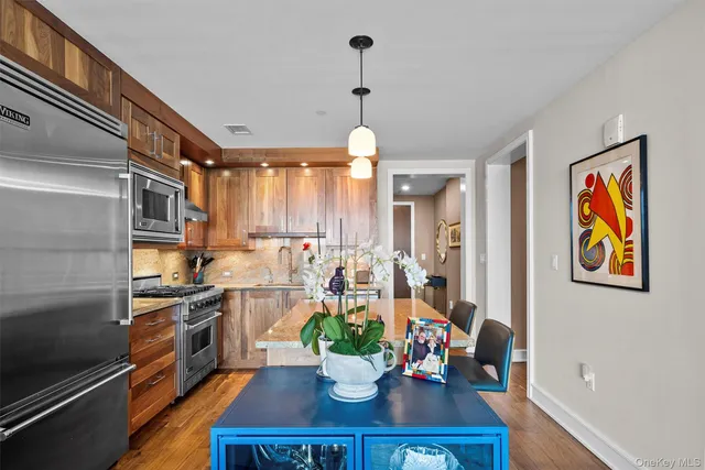 a kitchen with a table and chairs