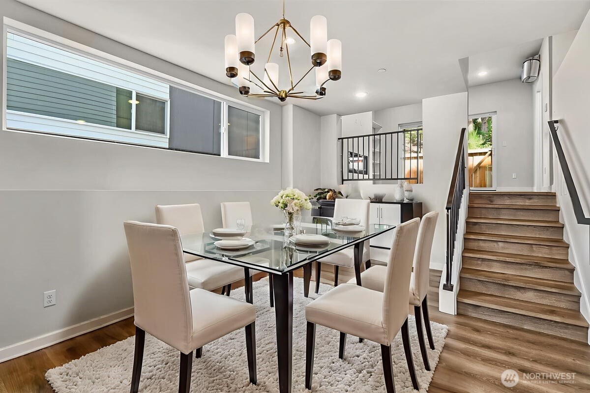 8922 Northeast 173rd Place, Unit A Bothell, WA 98011 - Photo 4 of 26 a view of a dining room with furniture