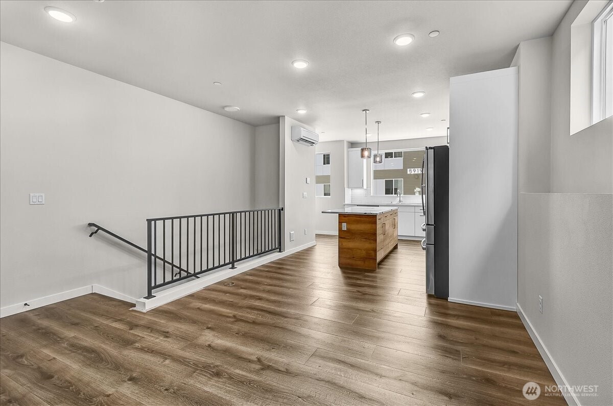 8922 Northeast 173rd Place, Unit A Bothell, WA 98011 - Photo 5 of 26 a view of kitchen living space with stainless steel appliances