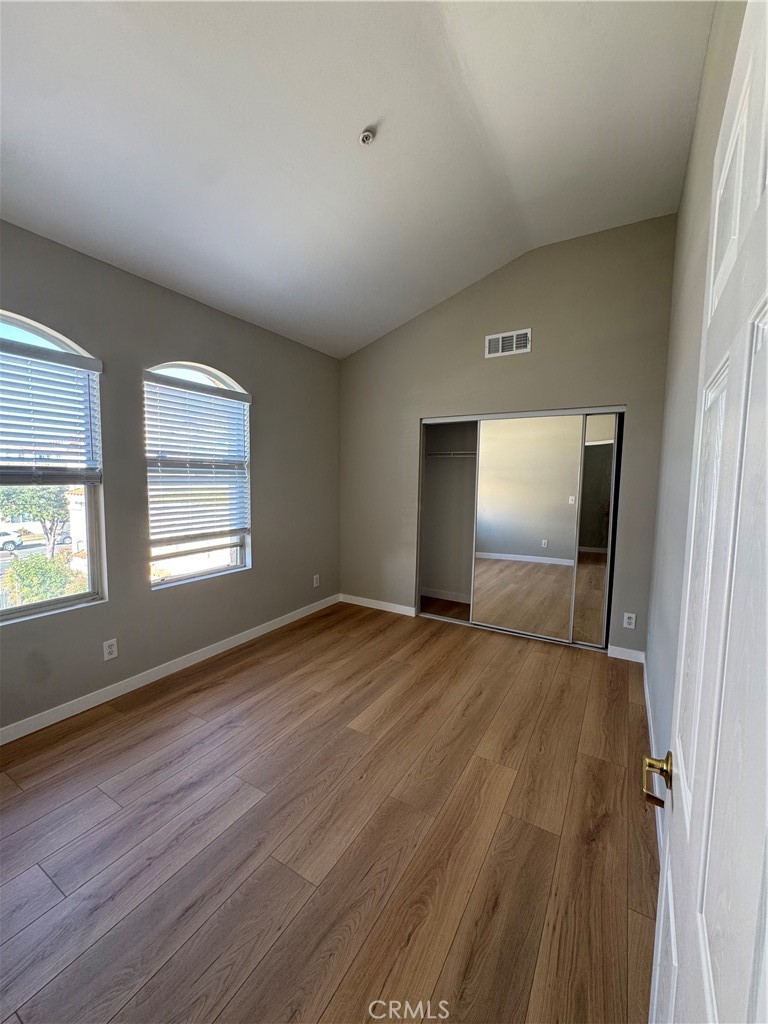 132 North 3rd Street, Unit A Alhambra, CA 91801 - Photo 11 of 15 an empty room with wooden floor and windows
