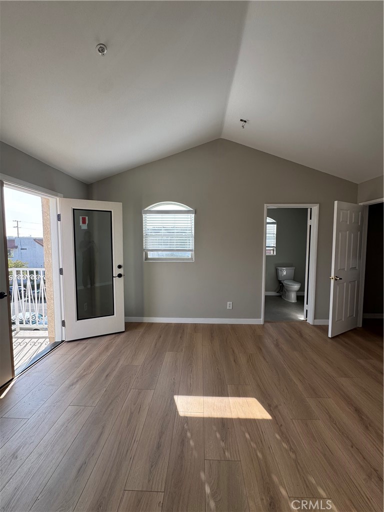 132 North 3rd Street, Unit A Alhambra, CA 91801 - Photo 14 of 15 a view of an empty room with wooden floor and a window