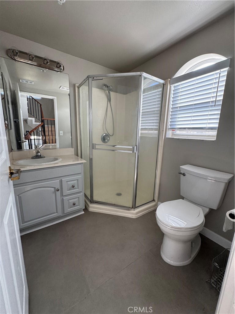 132 North 3rd Street, Unit A Alhambra, CA 91801 - Photo 9 of 15 a bathroom with a toilet sink and mirror
