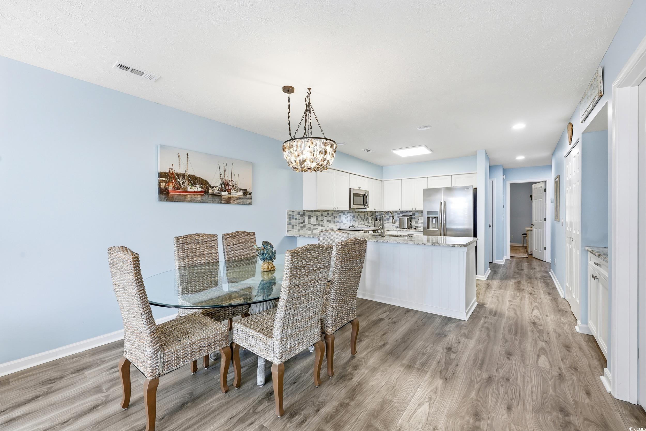 448 Pinehurst Lane, Unit 16F Pawleys Island, SC 29585 - Photo 10 of 31 Dining space with a chandelier, light wood-style flooring, and recessed lighting