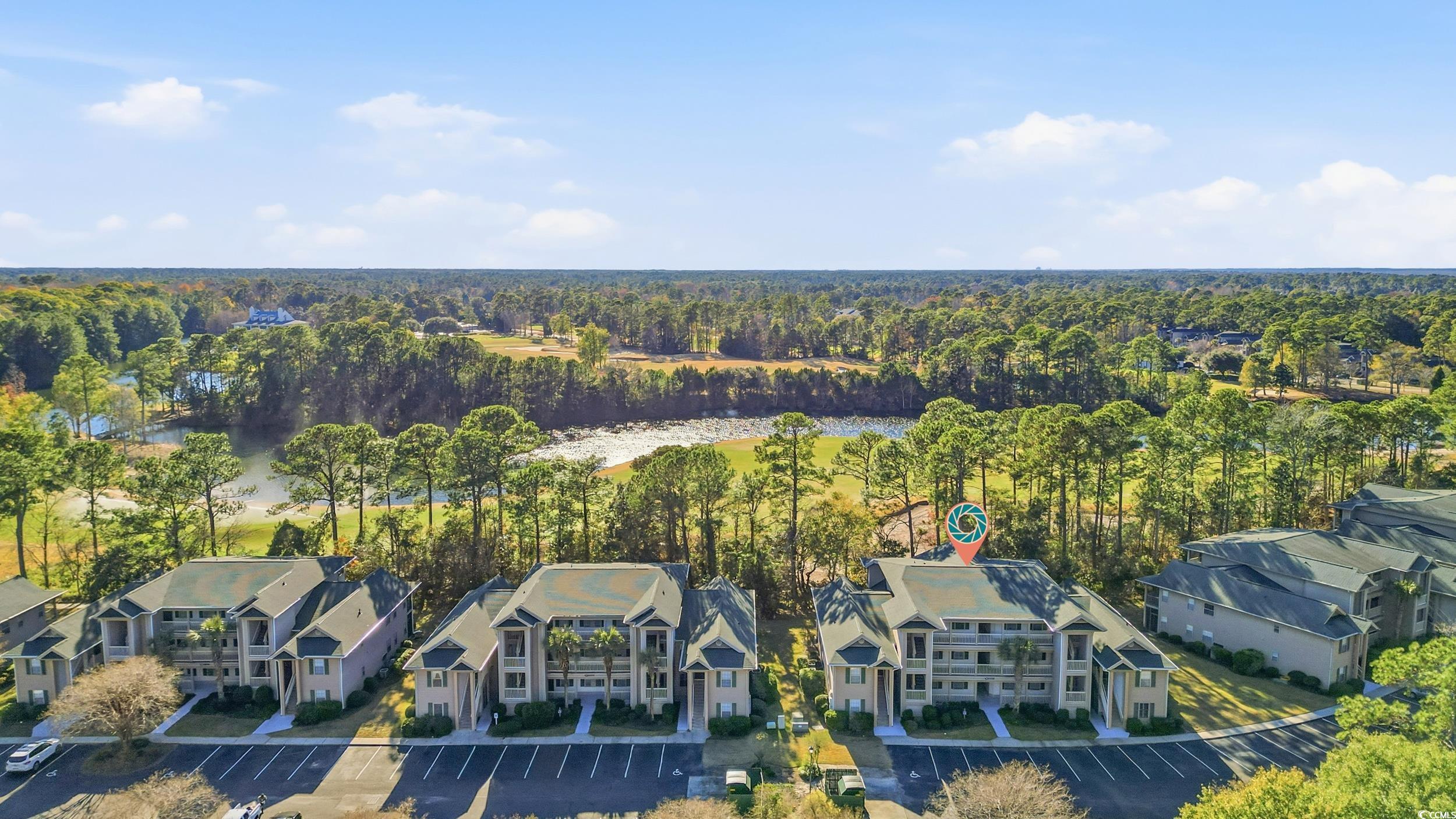 448 Pinehurst Lane, Unit 16F Pawleys Island, SC 29585 - Photo 15 of 31 Aerial view of residential area featuring a heavily wooded area